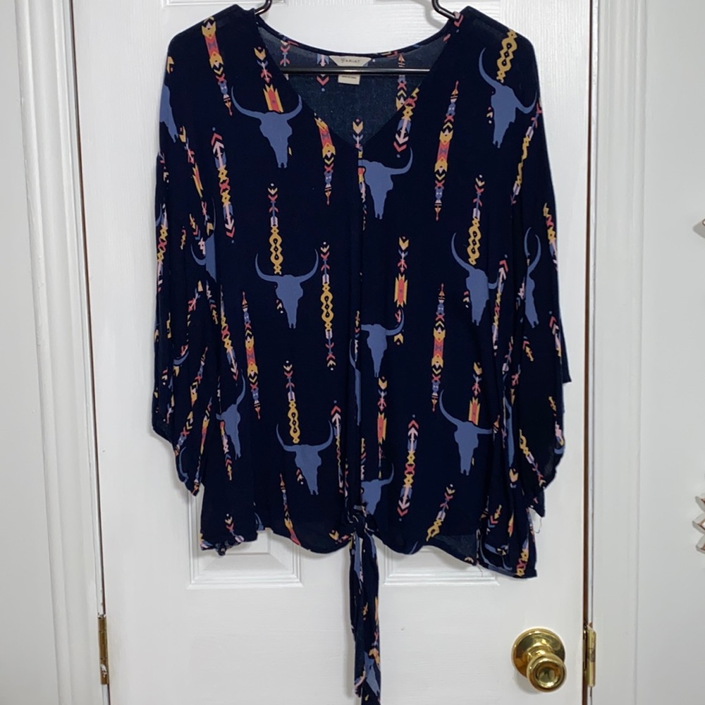 Ariat loose shirt with a tie in the front.